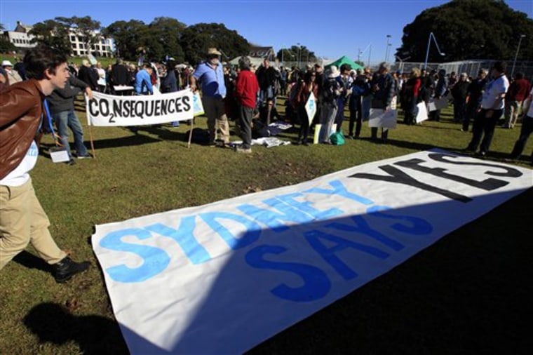 Supporters of a controversial carbon tax gather in June at a rally in Sydney.